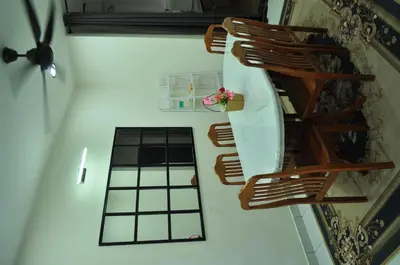 an overhead view of a room with a spiral staircase at Uwais Homestay Segari Lumut in Lumut