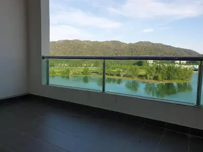 a balcony with a view of a lake at Marina Island Seaview Homestay in Lumut