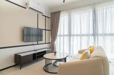 a living room with a couch and a table at Urban Suite By Bold@Seaview in Jelutong