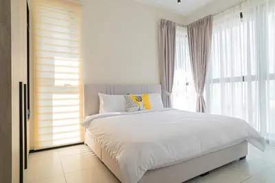 a bedroom with a white bed and a window at Urban Suite By Bold@Seaview in Jelutong