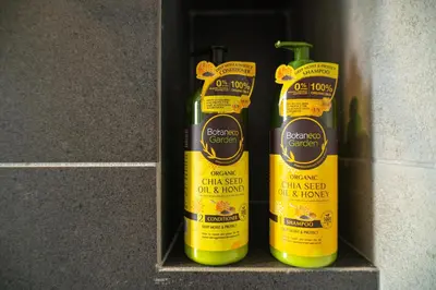 two bottles of cleaning products sitting on a shelf at Urban Suite By Bold@Seaview in Jelutong