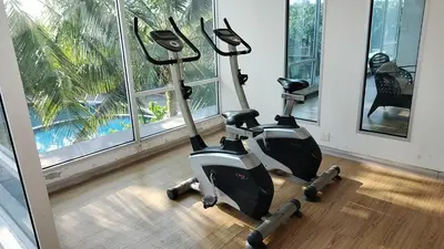 two exercise bikes in a room with a window at Idea Homestay 2 in Ipoh