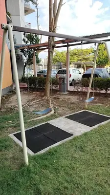a swing set in a yard with a tree at Idea Homestay 3 in Chemor