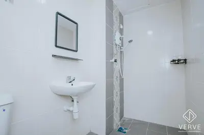 a white bathroom with a sink and a mirror at Ipoh Town Anderson Suites 4-6 pax by Verve in Ipoh