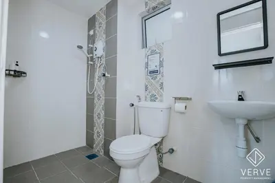 a bathroom with a toilet and a sink at Ipoh Town Anderson Suites 4-6 pax by Verve in Ipoh