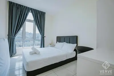 a white bedroom with a bed and a window at Ipoh Town Anderson Suites 4-6 pax by Verve in Ipoh