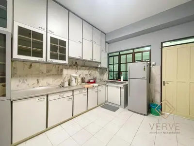 a kitchen with white cabinets and a refrigerator at Taman Saikat IPOH Happy Suites by Verve(12 pax) in Ipoh