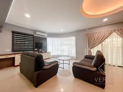 a living room with two couches and a table at Taman Saikat IPOH Happy Suites by Verve(12 pax) in Ipoh