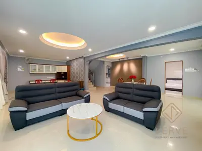 a living room with two couches and a table at Taman Saikat IPOH Happy Suites by Verve(12 pax) in Ipoh