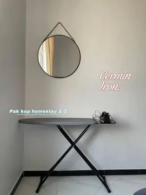 a mirror on a wall next to a table at ISLAMIC Pak Kop Homestay with private pool 2 in Parit Buntar