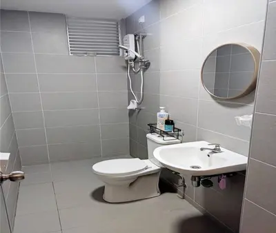 a bathroom with a toilet and a sink at IZZ Homestay MUSLiiM in Ipoh