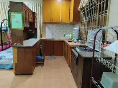 a kitchen with a sink and a stove at Penang Green Homestay 1st Floor in Permatang Pauh