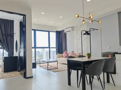a living room with a table and a couch at Modern Elegance - Urban Suites by Ocean Luxe in Jelutong