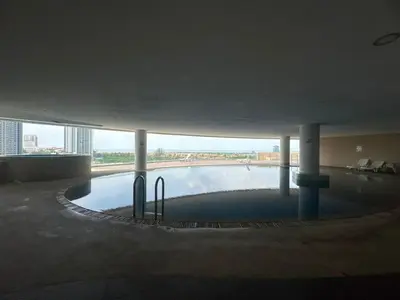 a circular pool of water in a building at Luxury Suites 118 Island Plaza in Tanjong Tokong