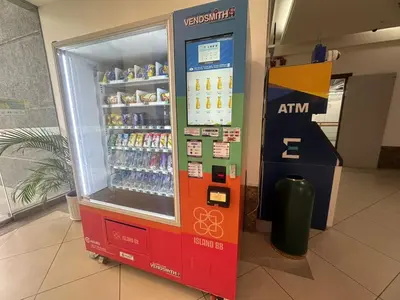 a soda vending machine in a building at Luxury Suites 118 Island Plaza in Tanjong Tokong