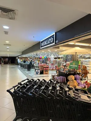 a shopping mall with black chairs in a store at Luxury Suites 118 Island Plaza in Tanjong Tokong