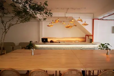 a dining room with a large wooden table with chairs at Some Place Else in George Town