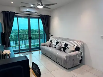a living room with a couch and a balcony at Meritus Premium Home Suite 8 Pax in Perai