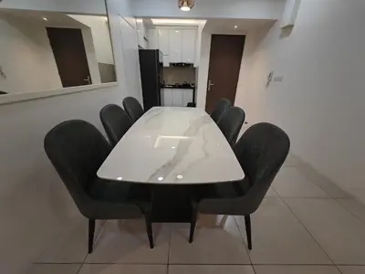 a conference room with a white table and black chairs at Meritus Premium Home Suite 8 Pax in Perai