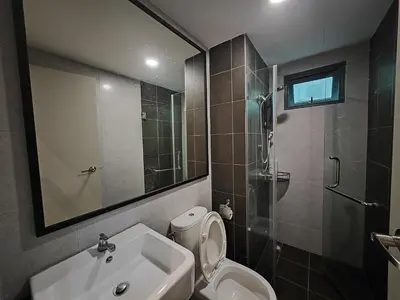 a bathroom with a toilet and a sink and a shower at Meritus Premium Home Suite 8 Pax in Perai