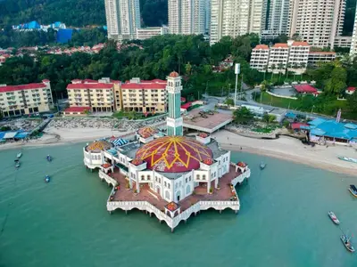an aerial view of a building in the water at Bintara Guesthouse Sri Sayang Batu Ferringhi in Batu Ferringhi