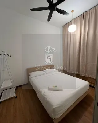 a bedroom with a bed with a ceiling fan at The9 Silverlakes Homestay in Batu Gajah