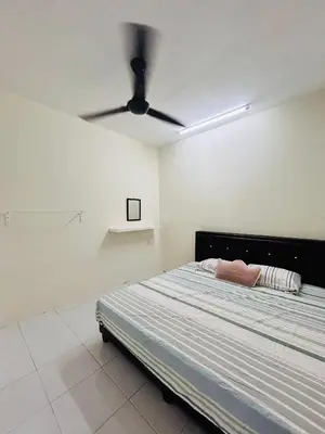 a bedroom with a bed with a ceiling fan at D'Iman UTP Seri Iskandar Homestay in Kampung Bota Kiri