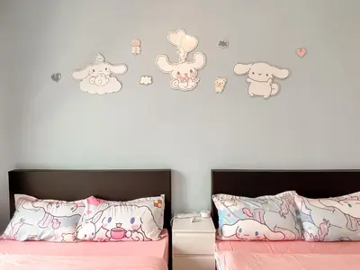 a bedroom with a bed with hello kitty wall decals at ANDERSON 2 Room Suite for 6-7 pax in Ipoh