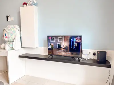 a table with a tv on top of it at ANDERSON 2 Room Suite for 6-7 pax in Ipoh
