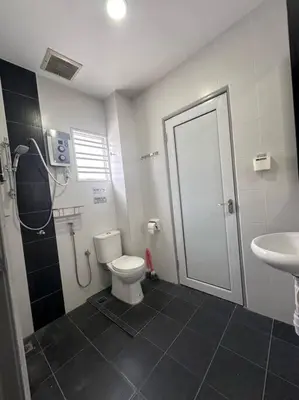 a bathroom with a toilet and a sink at H&H Homestay Premium House in Kepala Batas
