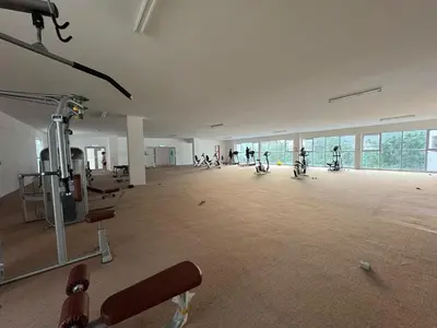 an empty gym with exercise equipment in a building at 100MBps Unifi Ipoh Anderson Residence Tatami AA2 in Ipoh