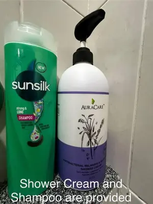a bottle of shower cream and shampoo are displayed at Matsurika Guest House - Kulim in Kulim