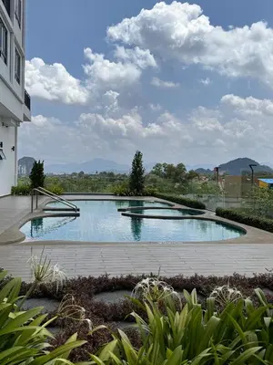 a swimming pool in the middle of a building at Sunway Onsen Suite in Tambun