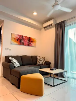a living room with a couch and a table at Sunway Onsen Suite in Tambun