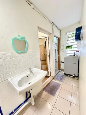 a bathroom with a sink and a toilet at K Inn 55 in George Town