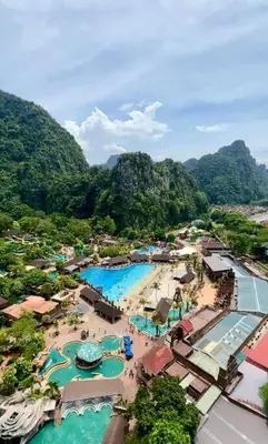 an aerial view of a resort with two swimming pools at ONSTAY Sunway Onsen Suites in Ipoh