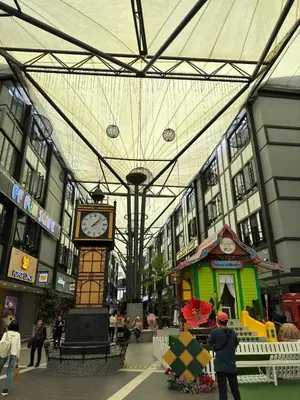 a building with a clock in the middle of it at DADDY HOMES 2 Emerald Avenue Centrum BRINCHANG VIEW in Brinchang