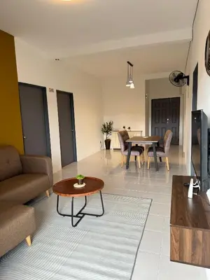 a living room with a couch and a table at DADDY HOMES 2 Emerald Avenue Centrum BRINCHANG VIEW in Brinchang