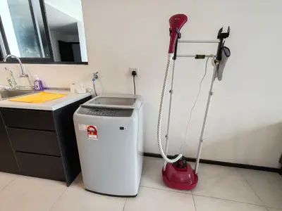a vacuum in a kitchen next to a sink at Luxurious Modern Suite at Urban Suites Georgetown by SuperStay in Jelutong
