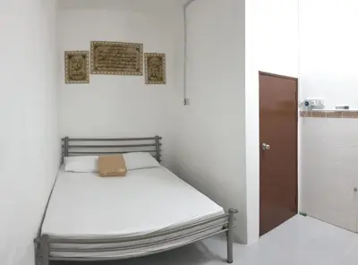 a small room with a bed in a bathroom at Nuha Kulim Hitech Homestay Islamic in Kulim
