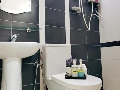 a bathroom with a white toilet and a sink at Cameron Brinchang 5 Min to Centrum 12pax Duplex Shophouse by City Home Empire in Brinchang