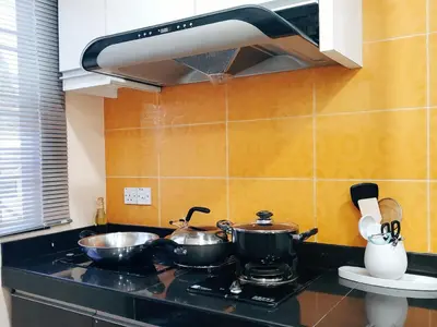 a kitchen with two pots and pans on a stove at Cameron Brinchang 5 Min to Centrum 12pax Duplex Shophouse by City Home Empire in Brinchang