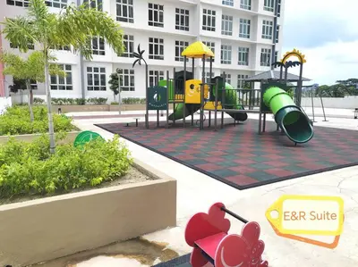 a playground in front of a large building at Anderson, Ipoh at E&R Suite in Kampong Simee