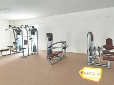 a gym with several tread machines in a room at Anderson, Ipoh at E&R Suite in Kampong Simee