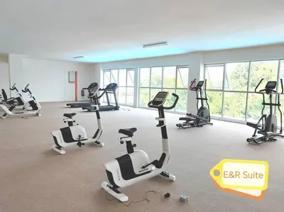 a gym with several treadmills and exercise bikes at Anderson, Ipoh at E&R Suite in Kampong Simee
