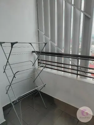 a chair in front of a window with a view at The Majestic Condo Ipoh Home Fairy 1 in Ipoh