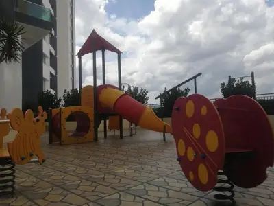 a playground with a slide in front of a building at The Majestic Condo Ipoh Home Fairy 1 in Ipoh