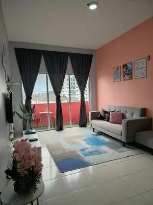 a living room with a couch and a large window at DLAZ HOMESTAY in Tanah Rata