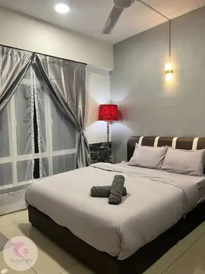 a bedroom with a bed with a hat on it at The Majestic Condo Ipoh Home Fairy 4 in Ipoh