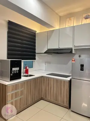 a kitchen with wooden cabinets and a white refrigerator at The Majestic Condo Ipoh Home Fairy 4 in Ipoh